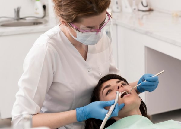 female-patient-having-procedure-done-dentist